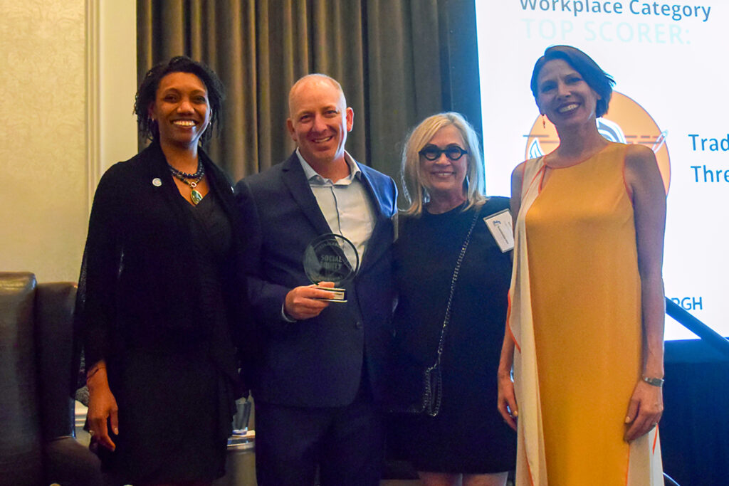 Executive Director Joylette Portlock awarding three of the Social Equity Sprints winners