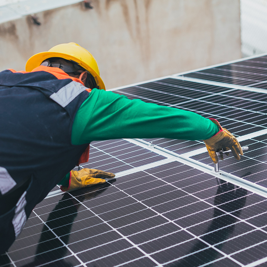 Technician working on a solar panel