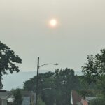 Smokey haze above rooftops in a residential Pittsburgh neighborhood