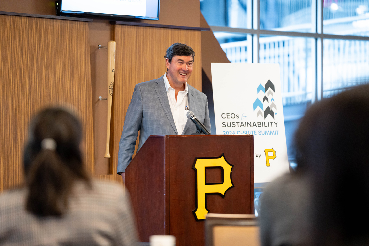 Bob Nutting stands at the podium delivering the 'Welcome to the Ballpark' address.