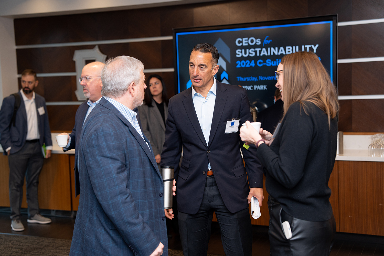 Troy Geanopulos, CEO of The Efficiency Network, speaks with guests.